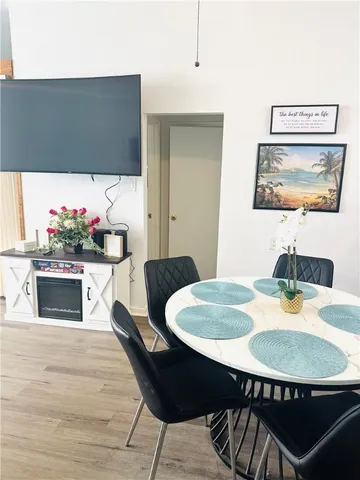 a kitchen with a refrigerator and a sink