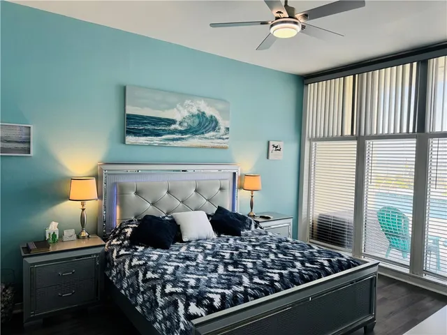 a view of a living room and floor to ceiling window