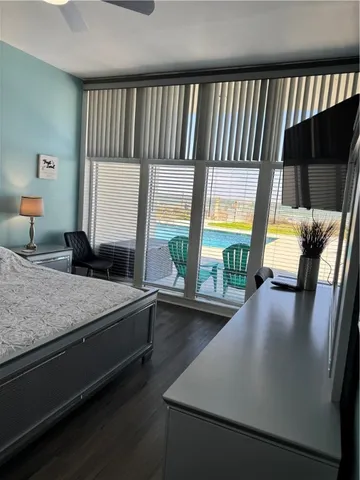 a bedroom with a large bed and a window