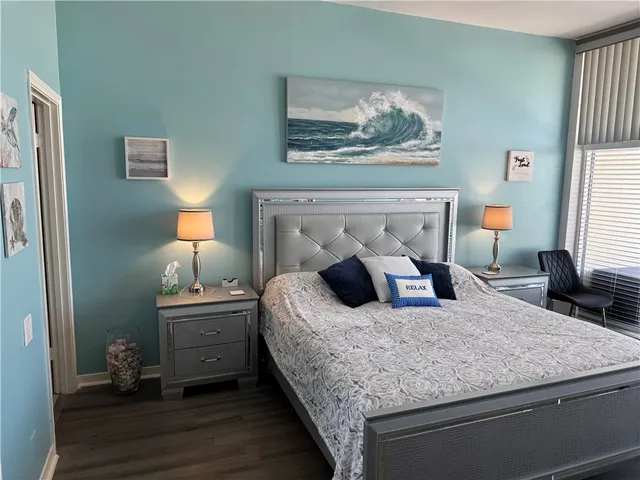 a living room with hard wood floor and a fireplace