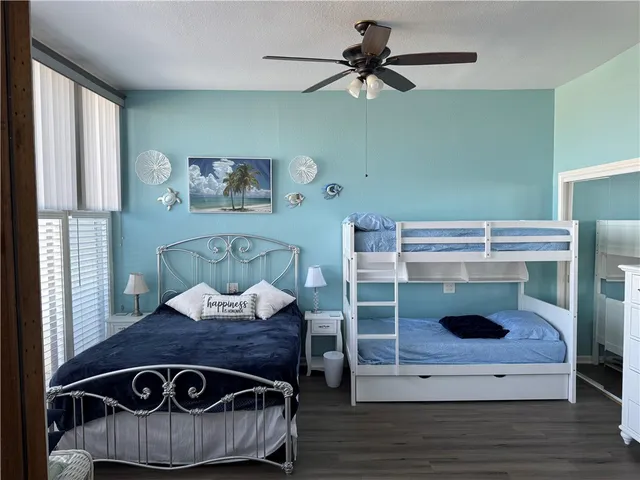 a living room with furniture and flat screen tv