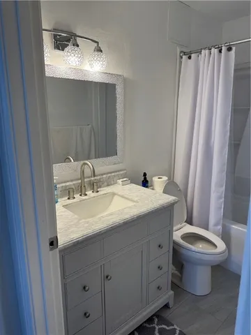 a bathroom with a sink a toilet and a bathtub