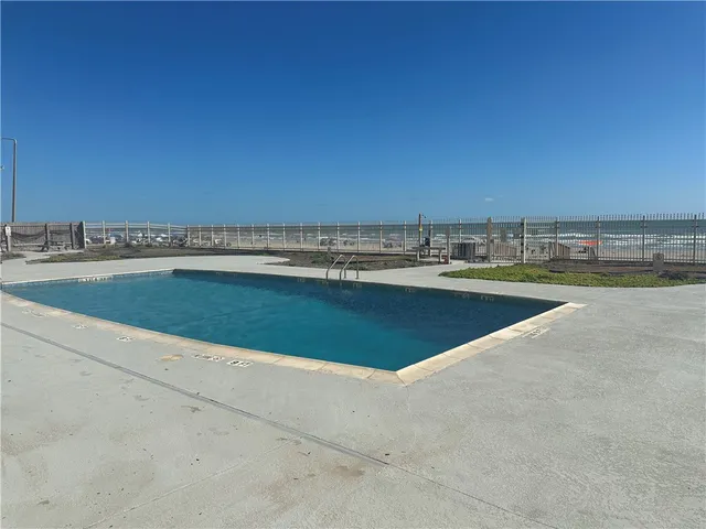 a view of a swimming pool and an ocean