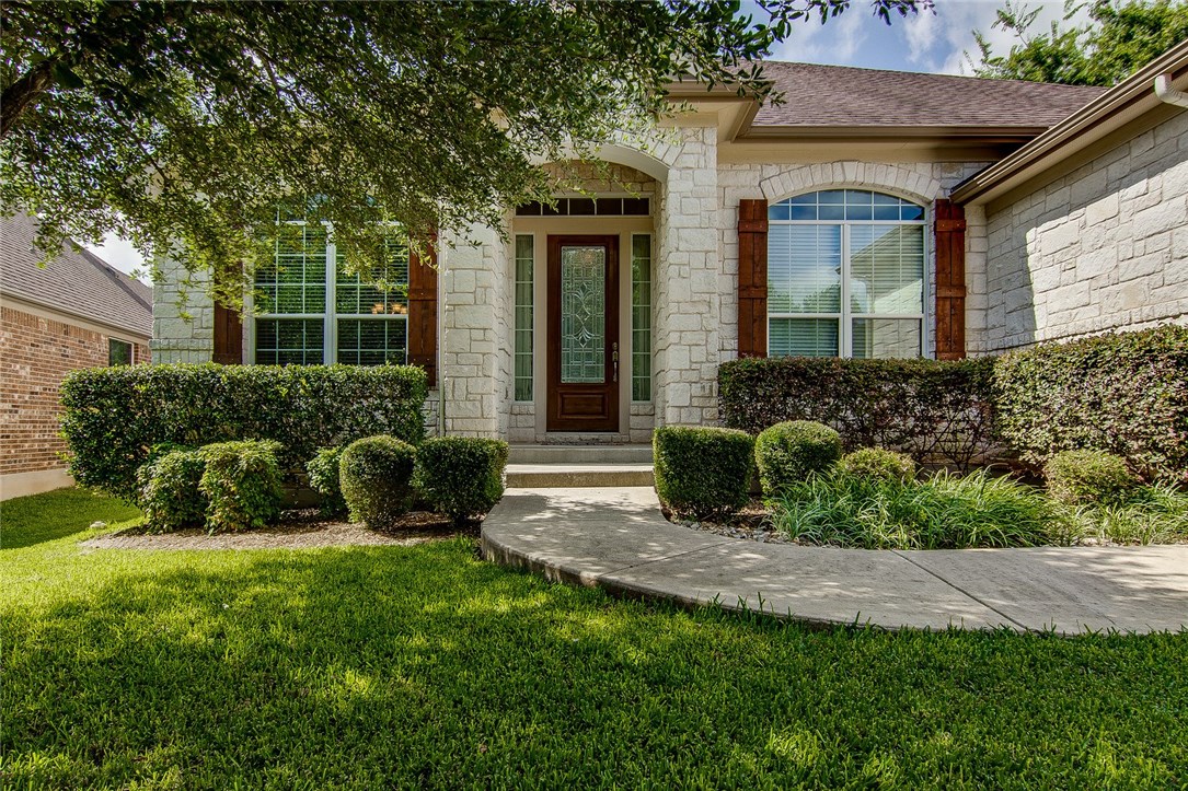 7729 Seneca Falls Loop Austin, TX 78739 - Photo 1 of 1 a view of a house with a yard and plants