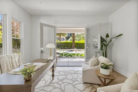 a bathroom with a double vanity sink and a mirror
