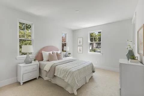 a bathroom with a granite countertop toilet a sink and a mirror