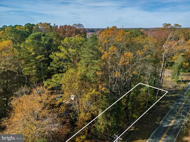 a front view of a house with a garden and garage