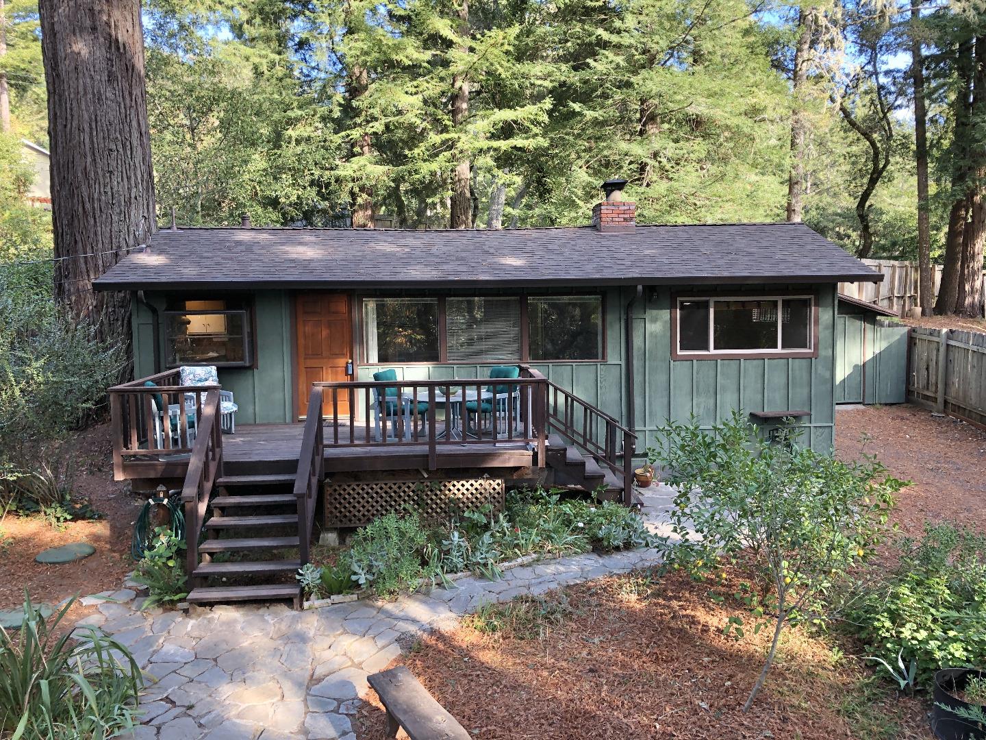 187 Chapman Road Woodside, CA 94062 - Photo 1 of 29 a front view of a house with garden