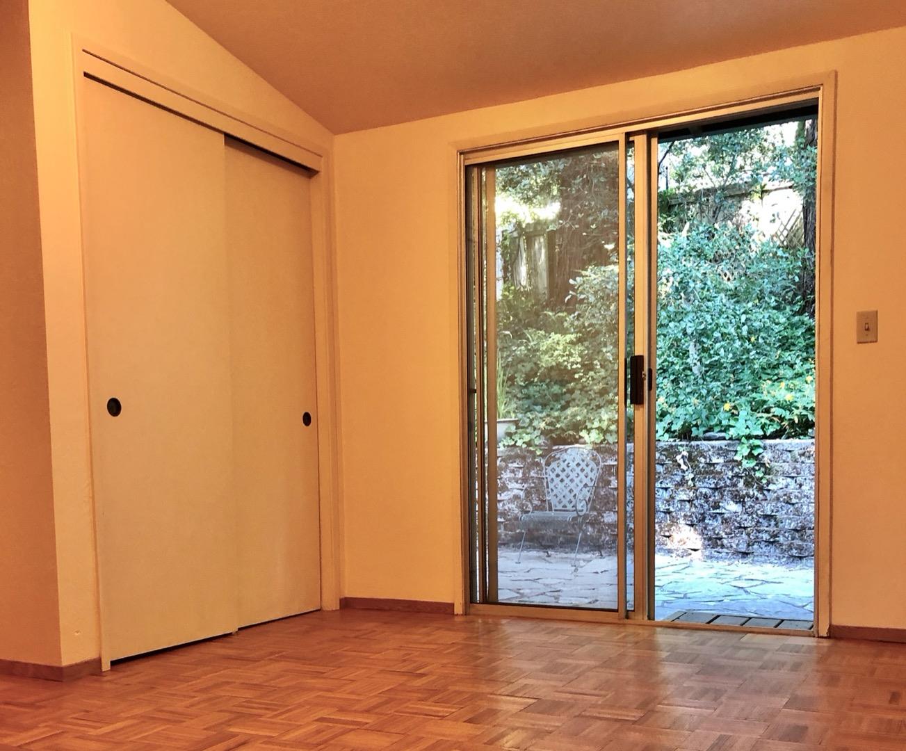 187 Chapman Road Woodside, CA 94062 - Photo 13 of 29 a view of a back yard from a room with wooden floor