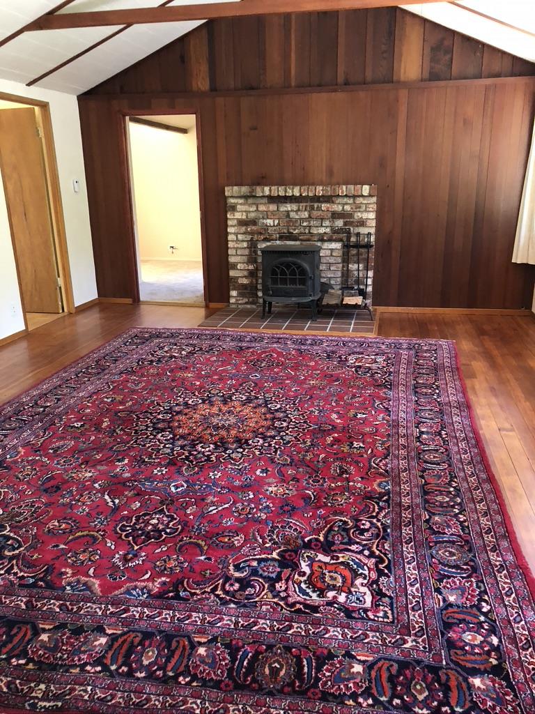 187 Chapman Road Woodside, CA 94062 - Photo 5 of 29 a view of empty room with furniture and fireplace