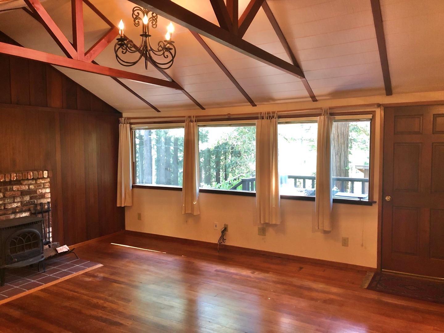 187 Chapman Road Woodside, CA 94062 - Photo 6 of 29 a view of an empty room with wooden floor and a window