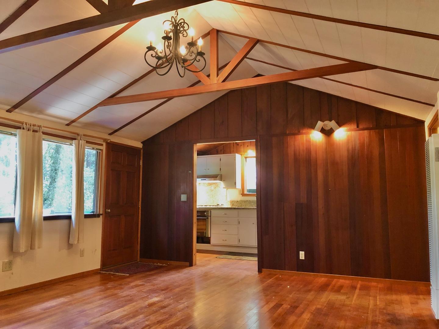 187 Chapman Road Woodside, CA 94062 - Photo 7 of 29 an empty room with wooden floor and windows
