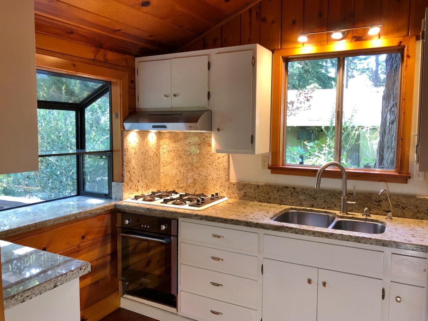 187 Chapman Road Woodside, CA 94062 - Photo 9 of 29 a kitchen with sink a window and cabinets