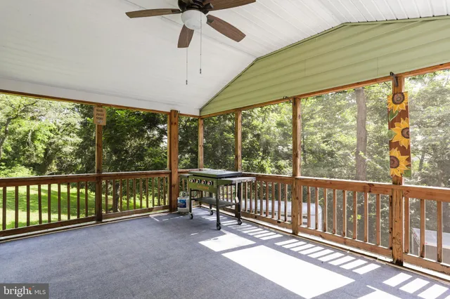 a view of a balcony with wooden floor
