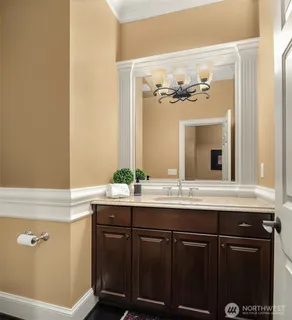 a bathroom with a double vanity sink mirror and shower