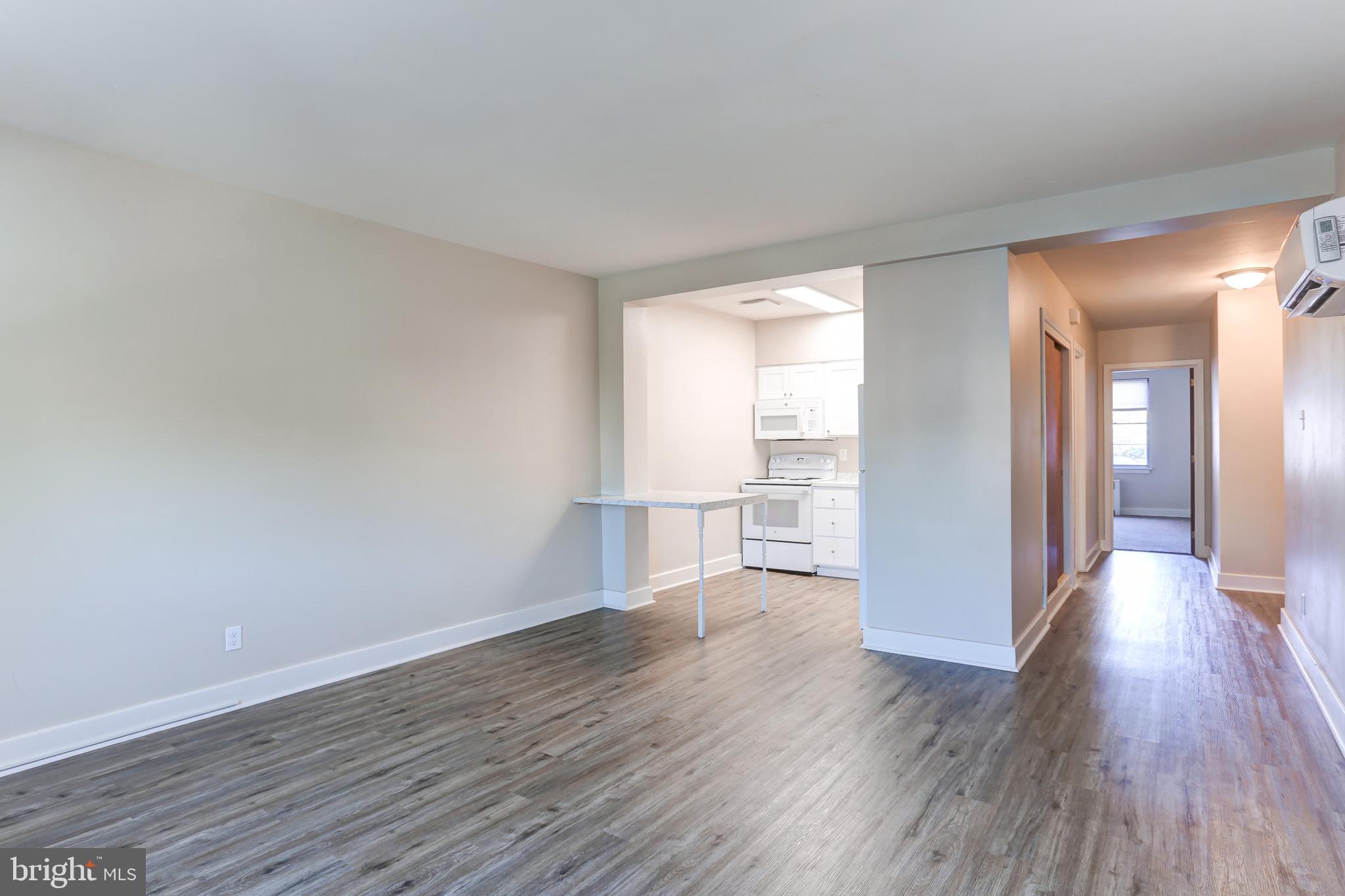 310 Bridge Street, Unit A New Cumberland, PA 17070 - Photo 3 of 7 a view of a room with wooden floor