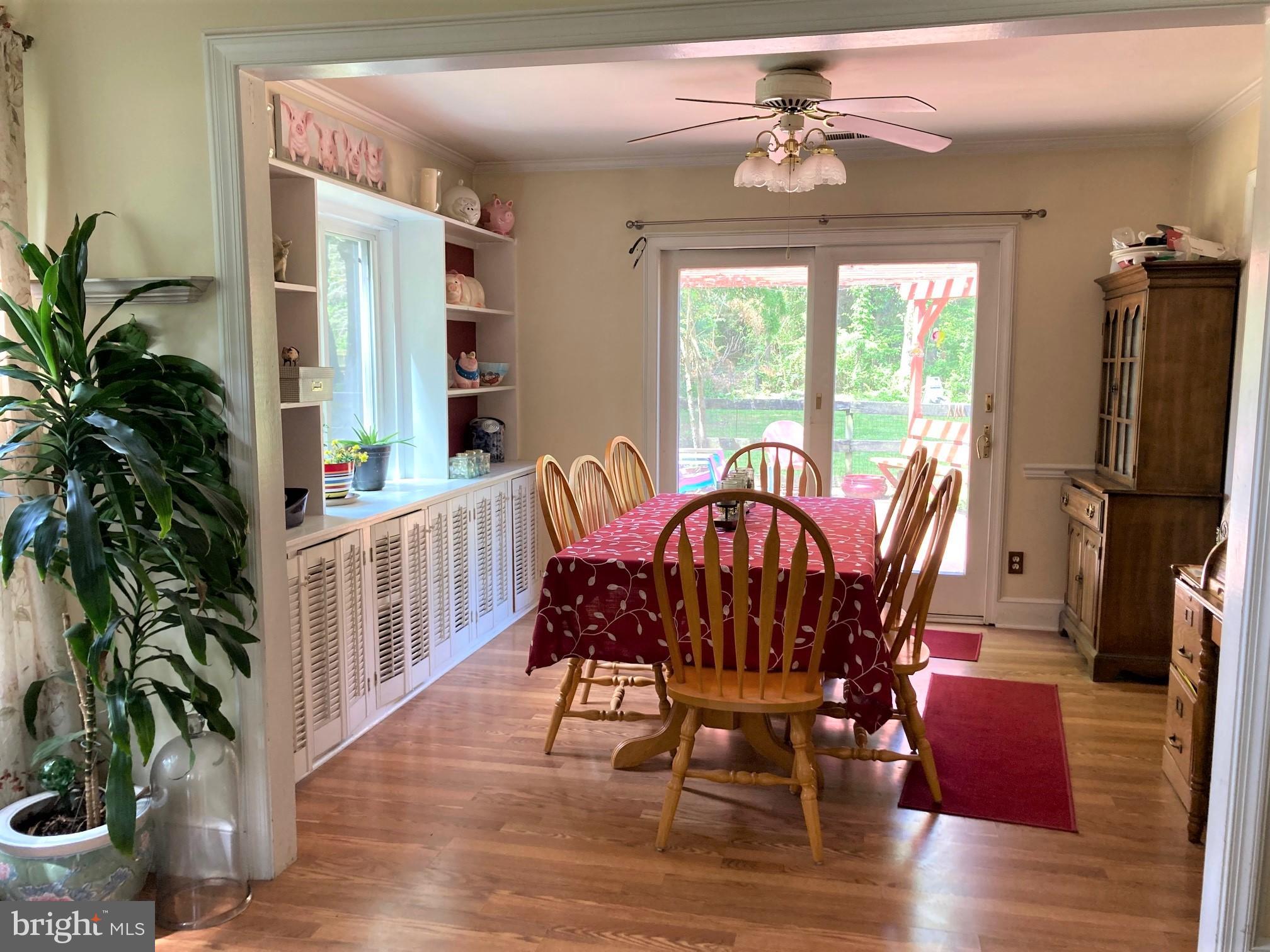 6125 Sandy Point Road Prince Frederick, MD 20678 - Photo 9 of 56 DR has built-ins & access to Deck and Kitchen