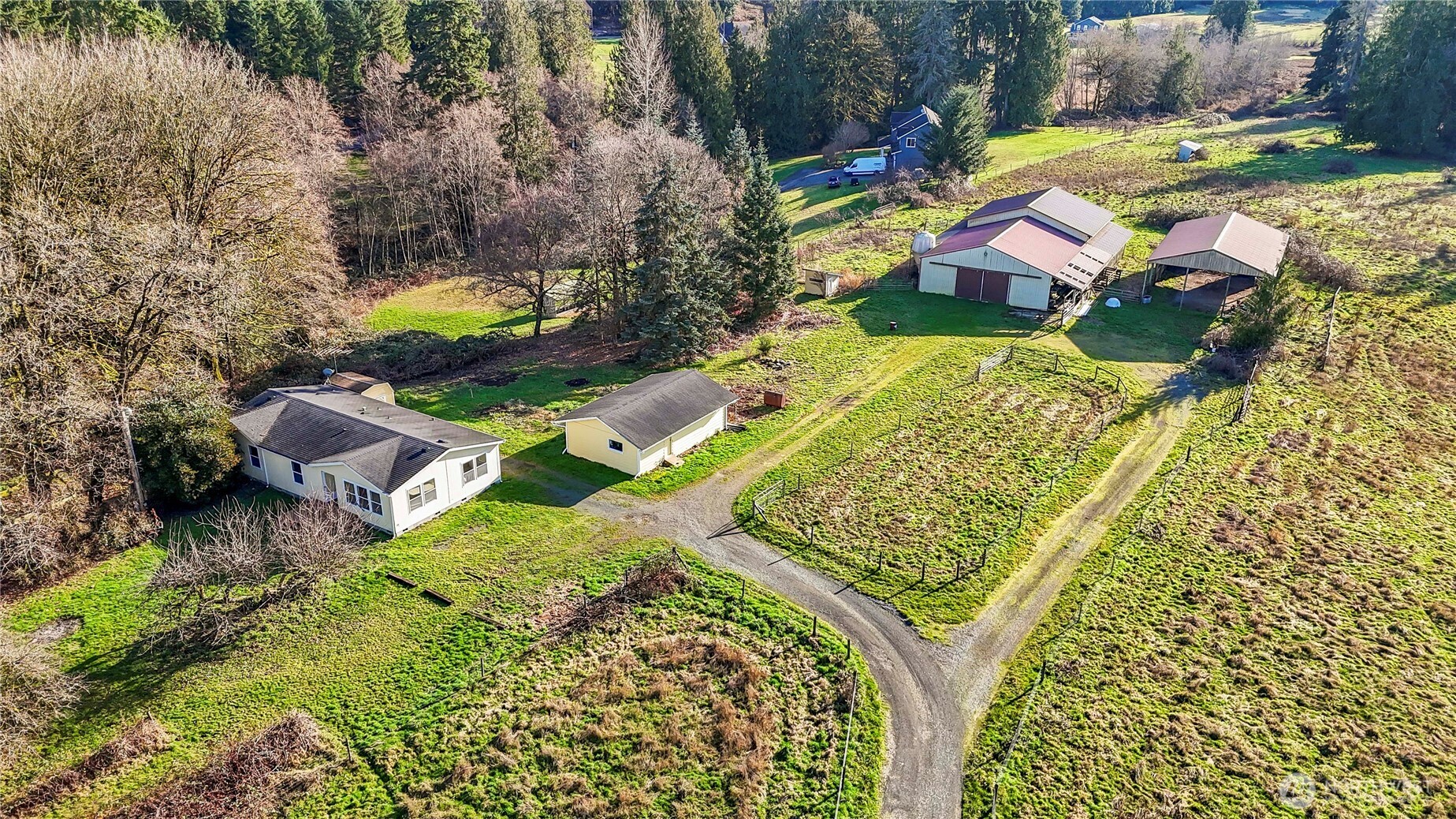14630 High Bridge Road Monroe, WA 98272 - Photo 1 of 40 an aerial view of a house with a garden and lake view