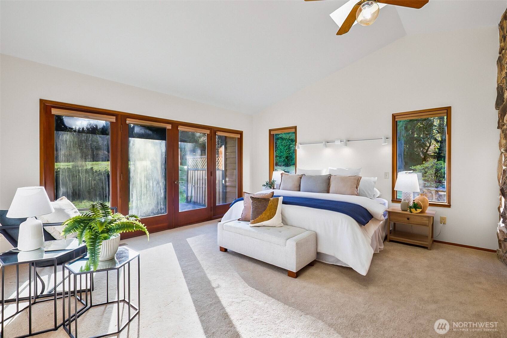 14630 High Bridge Road Monroe, WA 98272 - Photo 11 of 40 a spacious bedroom with a bed and ceiling potted plant