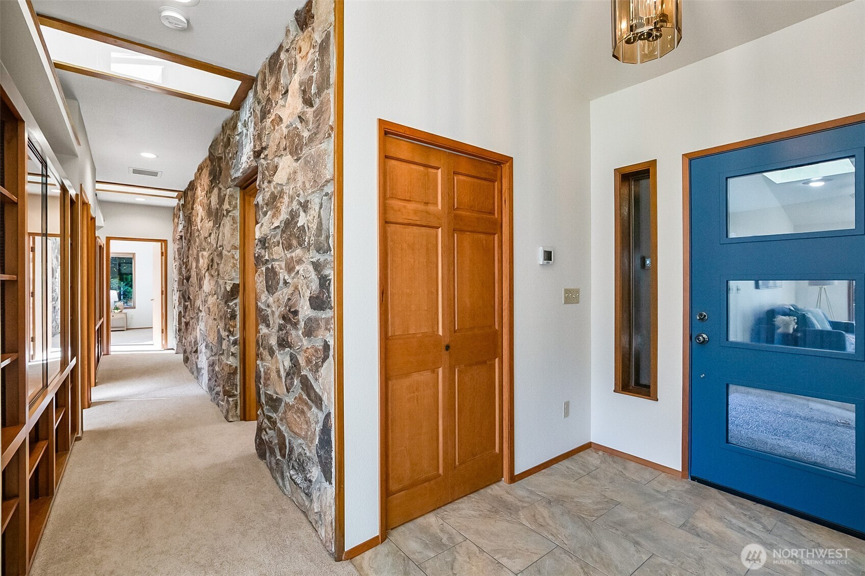 14630 High Bridge Road Monroe, WA 98272 - Photo 4 of 40 a view of a hallway with wooden shelves