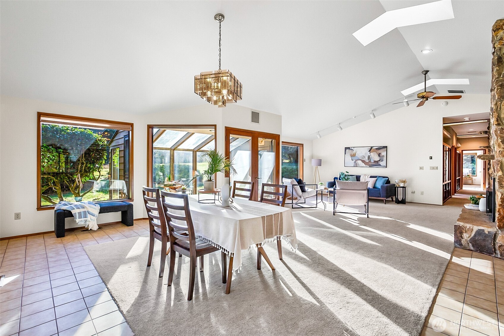 14630 High Bridge Road Monroe, WA 98272 - Photo 7 of 40 a view of a dining room and livingroom with furniture large windows a chandelier