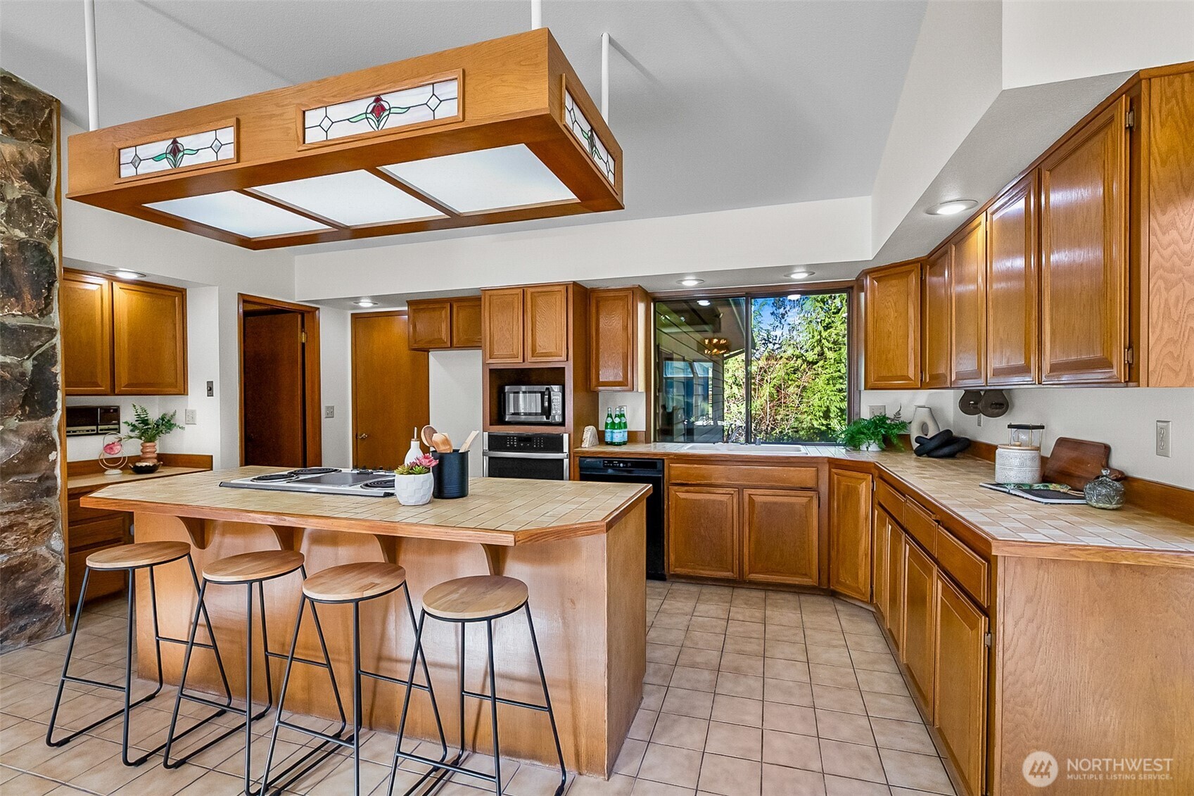 14630 High Bridge Road Monroe, WA 98272 - Photo 9 of 40 a kitchen with stainless steel appliances granite countertop a stove a sink and a refrigerator