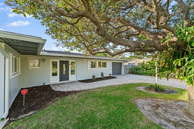 a view of a lake with a house swimming pool and outdoor space