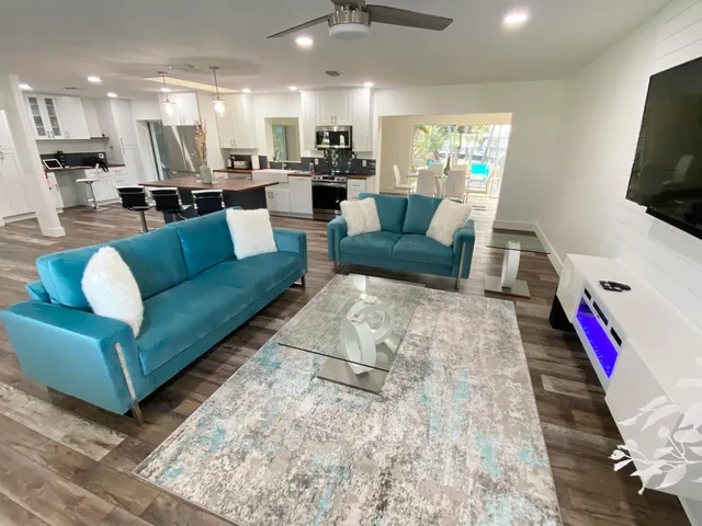 a living room with furniture and a flat screen tv