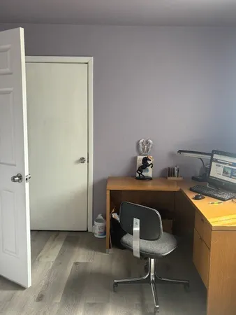 a bathroom with a glass shower door