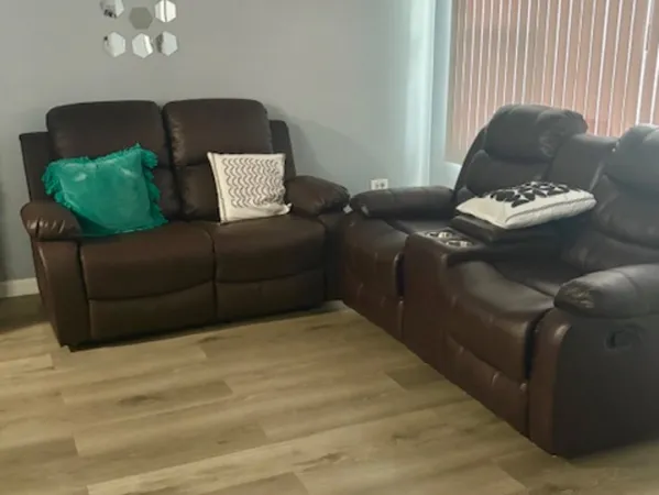 a view of a dining room with furniture and chandelier