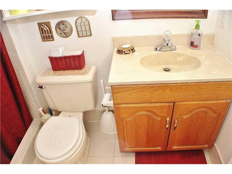 22170 Southwest 64th Way Boca Raton, FL 33428 - Photo 11 of 17 a bathroom with a toilet and a sink