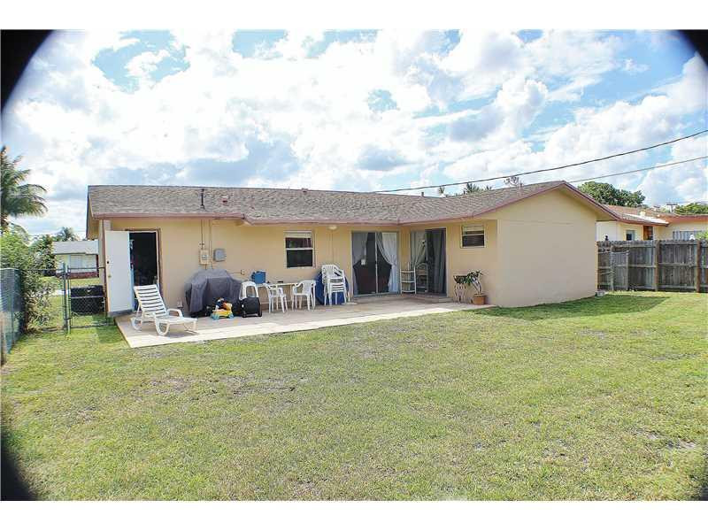 22170 Southwest 64th Way Boca Raton, FL 33428 - Photo 15 of 17 a view of a house with backyard porch and garden