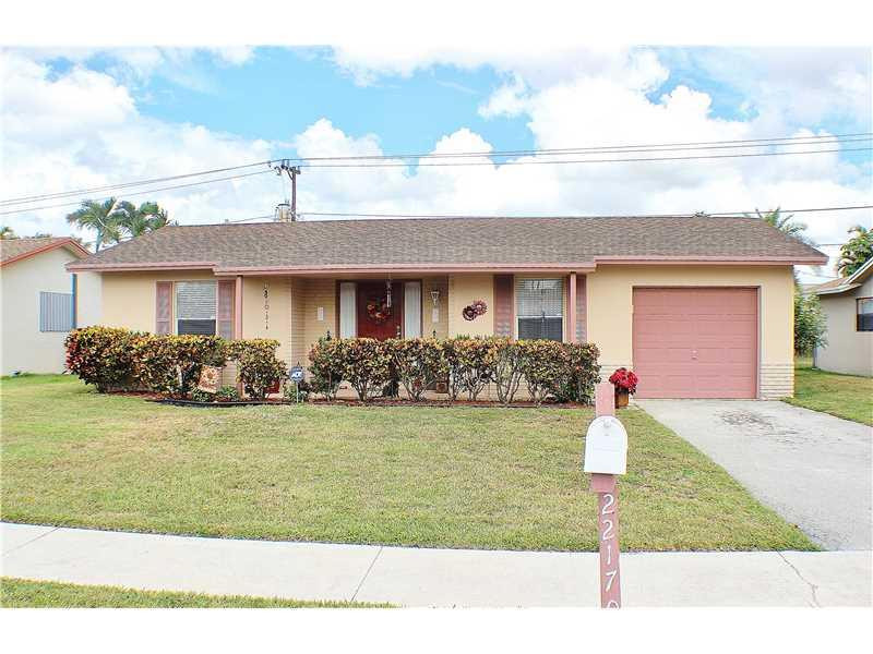 22170 Southwest 64th Way Boca Raton, FL 33428 - Photo 17 of 17 a front view of a house with garden