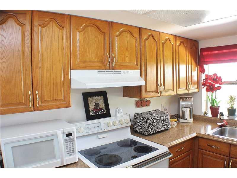 22170 Southwest 64th Way Boca Raton, FL 33428 - Photo 5 of 17 a kitchen with a sink cabinets and window