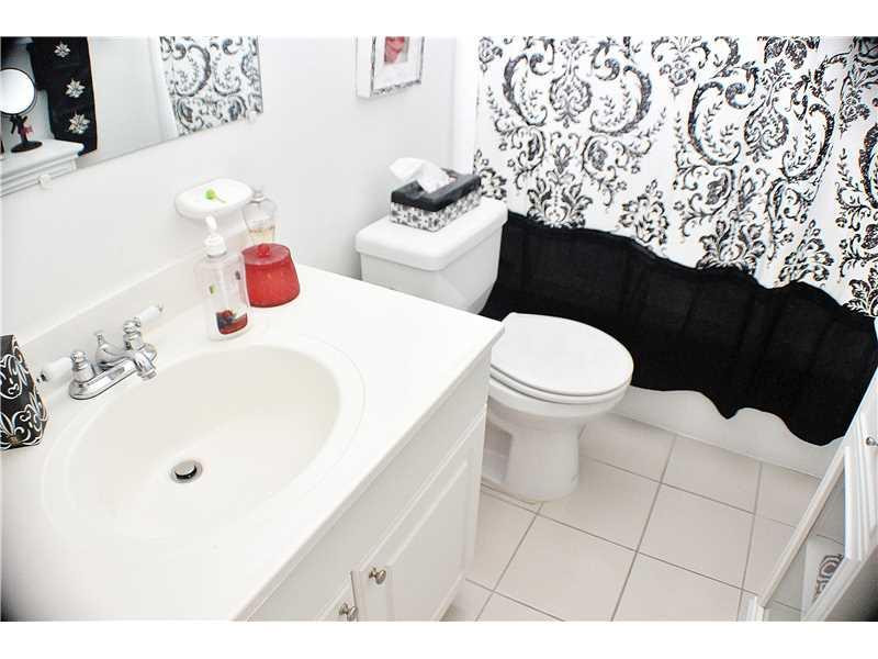 22170 Southwest 64th Way Boca Raton, FL 33428 - Photo 9 of 17 a bathroom with a sink toilet and a shower