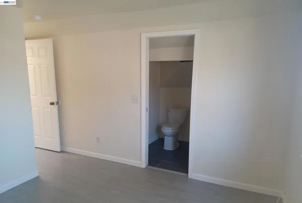 a bathroom with a toilet and a sink