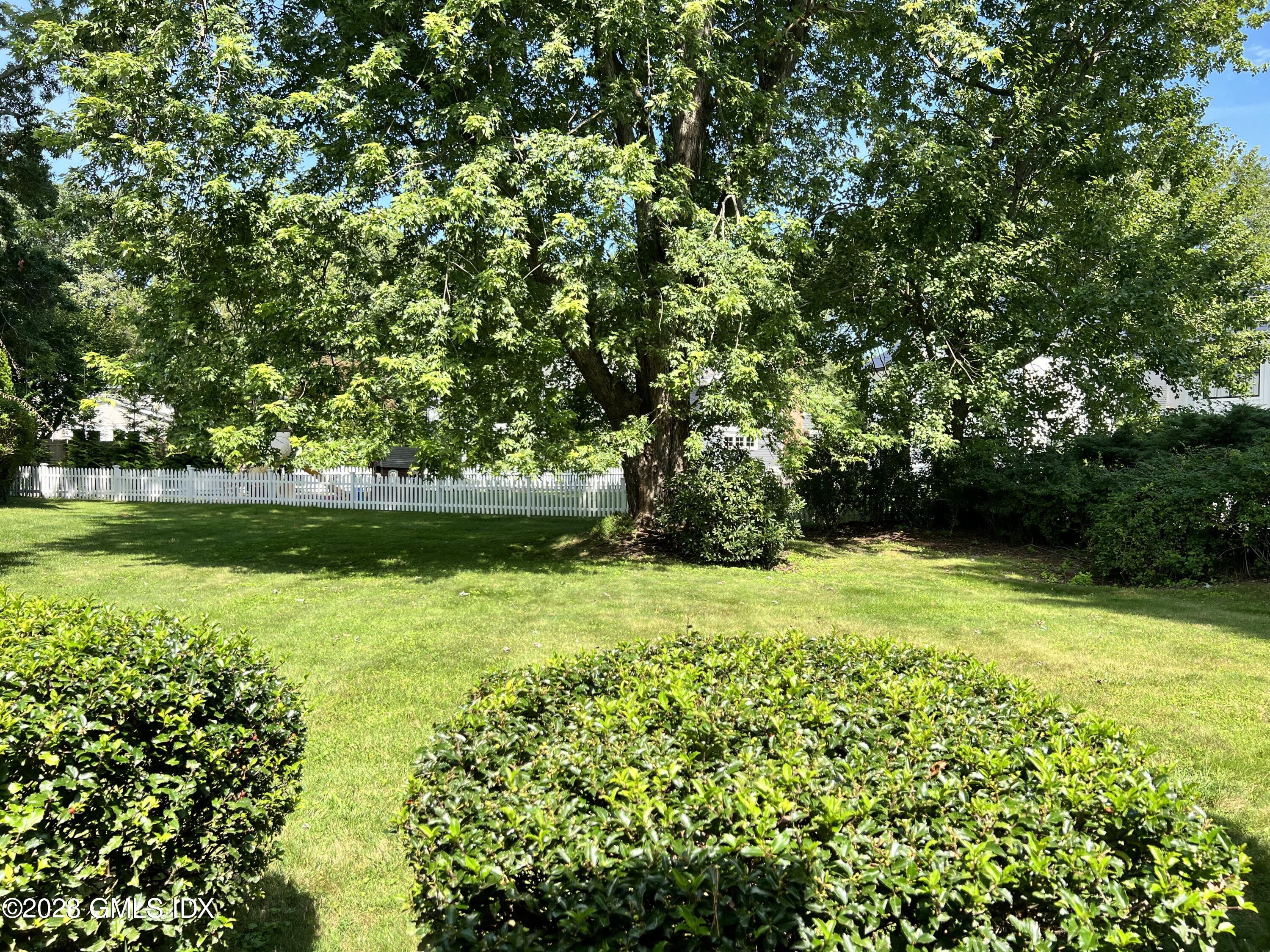 5 Tory Road Riverside, CT 06878 - Photo 24 of 26 a view of a garden with a bench