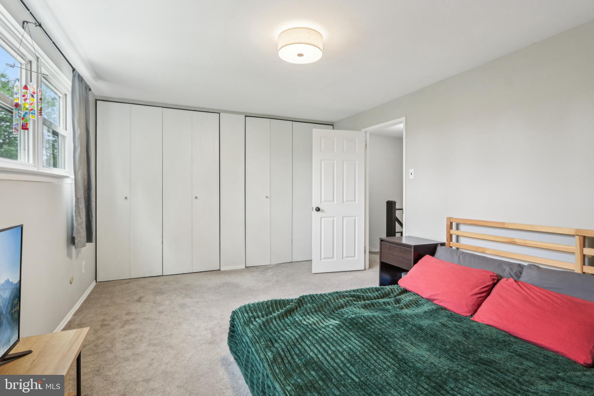 3207 Fairdale Road Philadelphia, PA 19154 - Photo 39 of 49 a spacious bedroom with a bed and a window