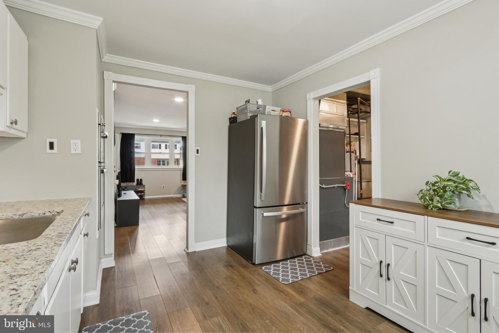 3207 Fairdale Road Philadelphia, PA 19154 - Photo 6 of 49 a kitchen with a refrigerator a sink and wooden floor