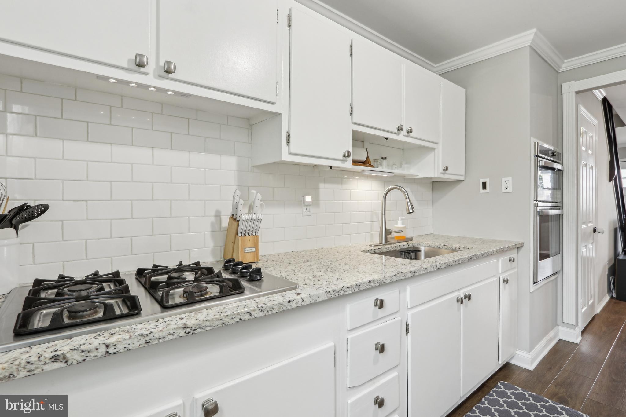 3207 Fairdale Road Philadelphia, PA 19154 - Photo 8 of 49 a kitchen with stainless steel appliances a sink a stove and cabinets