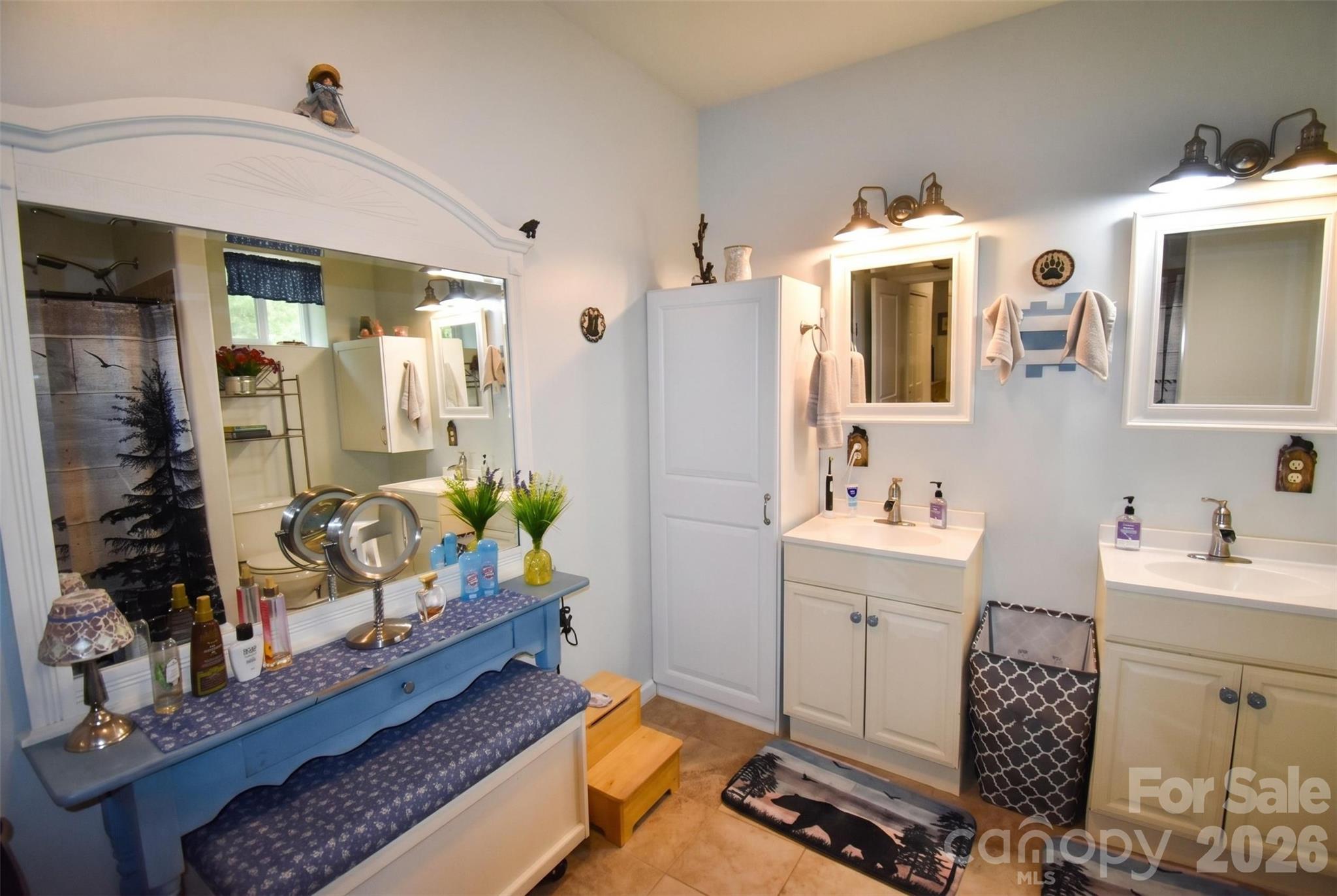 945 North Country Club Road Brevard, NC 28712 - Photo 29 of 42 a spacious bathroom with double vanity sink and a mirror