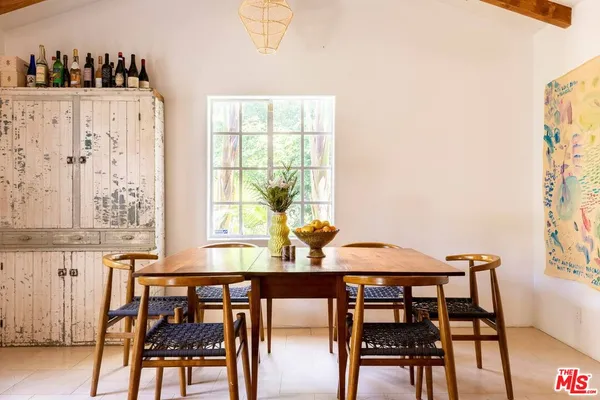 a view of a dining room with furniture and window