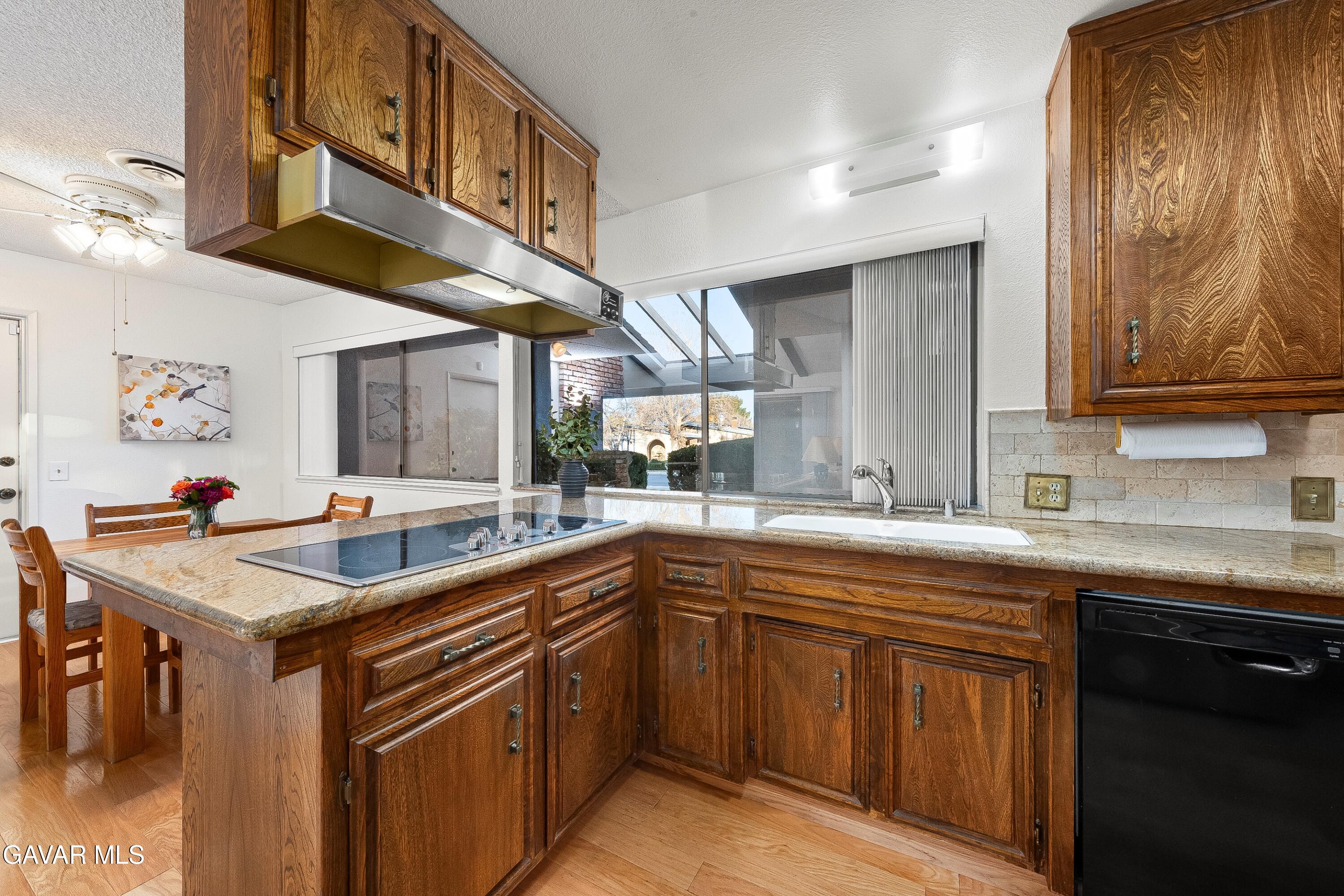 43755 Sentry Lane Lancaster, CA 93536 - Photo 12 of 36 a kitchen with a sink and cabinets