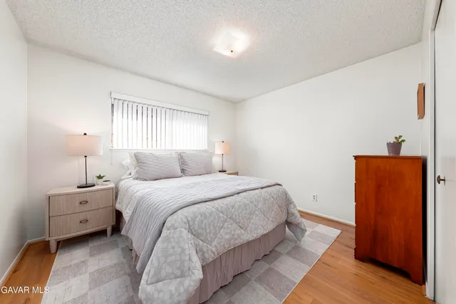 a bedroom with bed and window