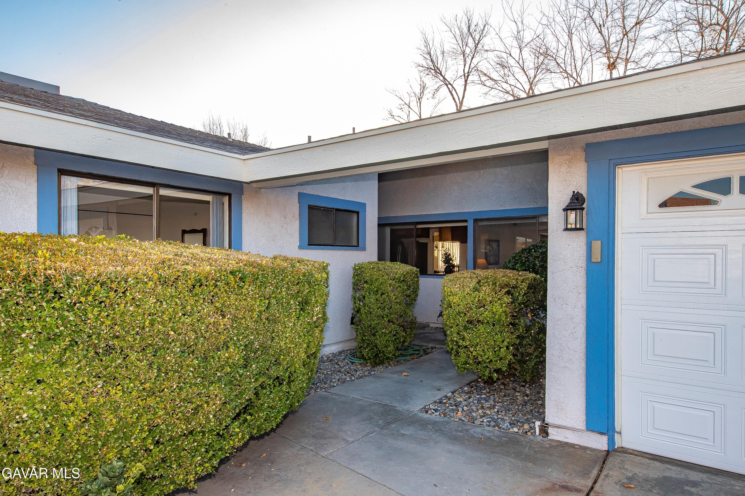 43755 Sentry Lane Lancaster, CA 93536 - Photo 2 of 36 a front view of a house with garden