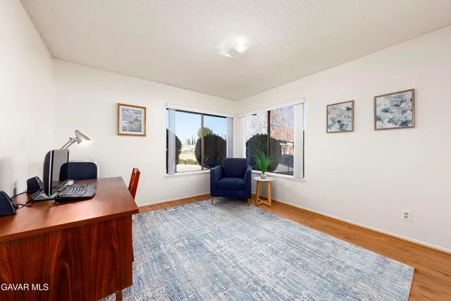 a bedroom with furniture and a window