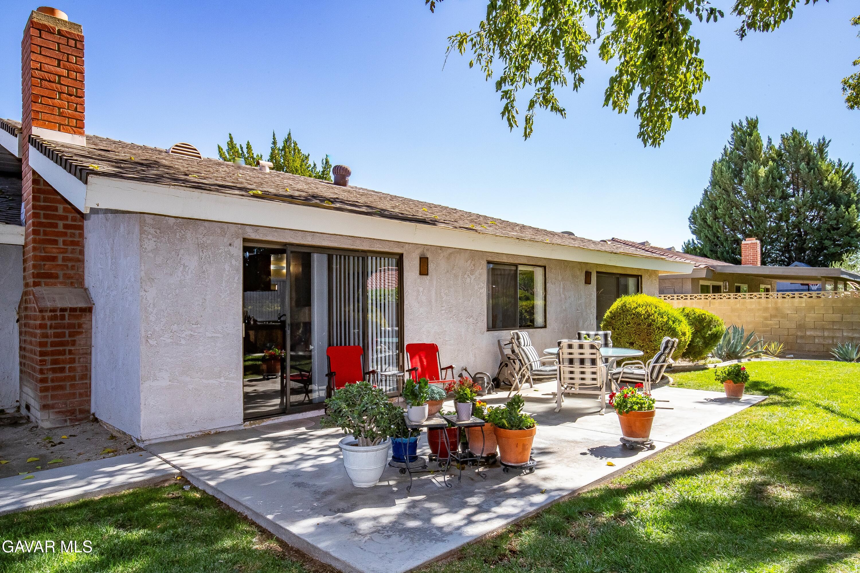 43755 Sentry Lane Lancaster, CA 93536 - Photo 27 of 36 a view of a house with sitting area and garden view