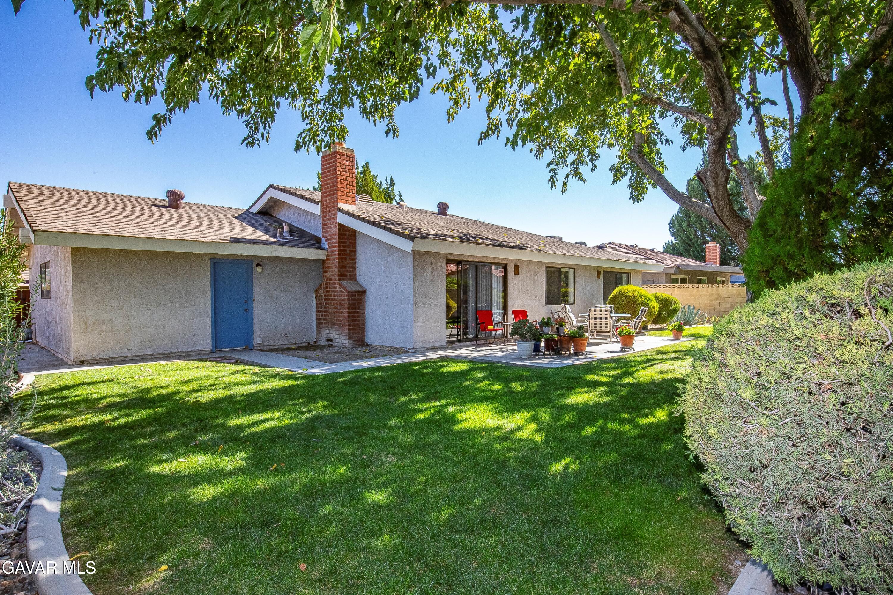 43755 Sentry Lane Lancaster, CA 93536 - Photo 33 of 36 a view of a house with a backyard