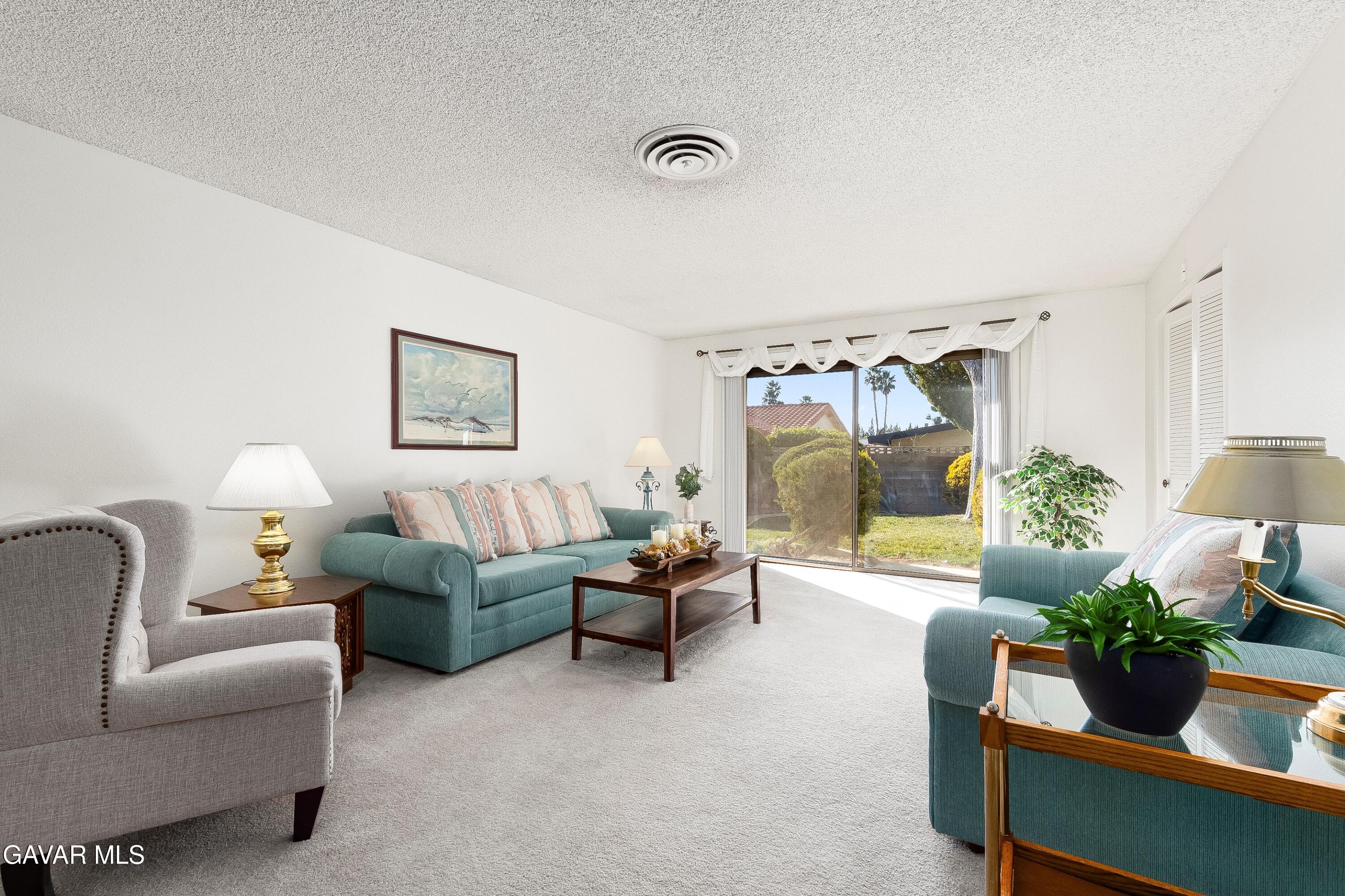 43755 Sentry Lane Lancaster, CA 93536 - Photo 4 of 36 a living room with furniture and a potted plant