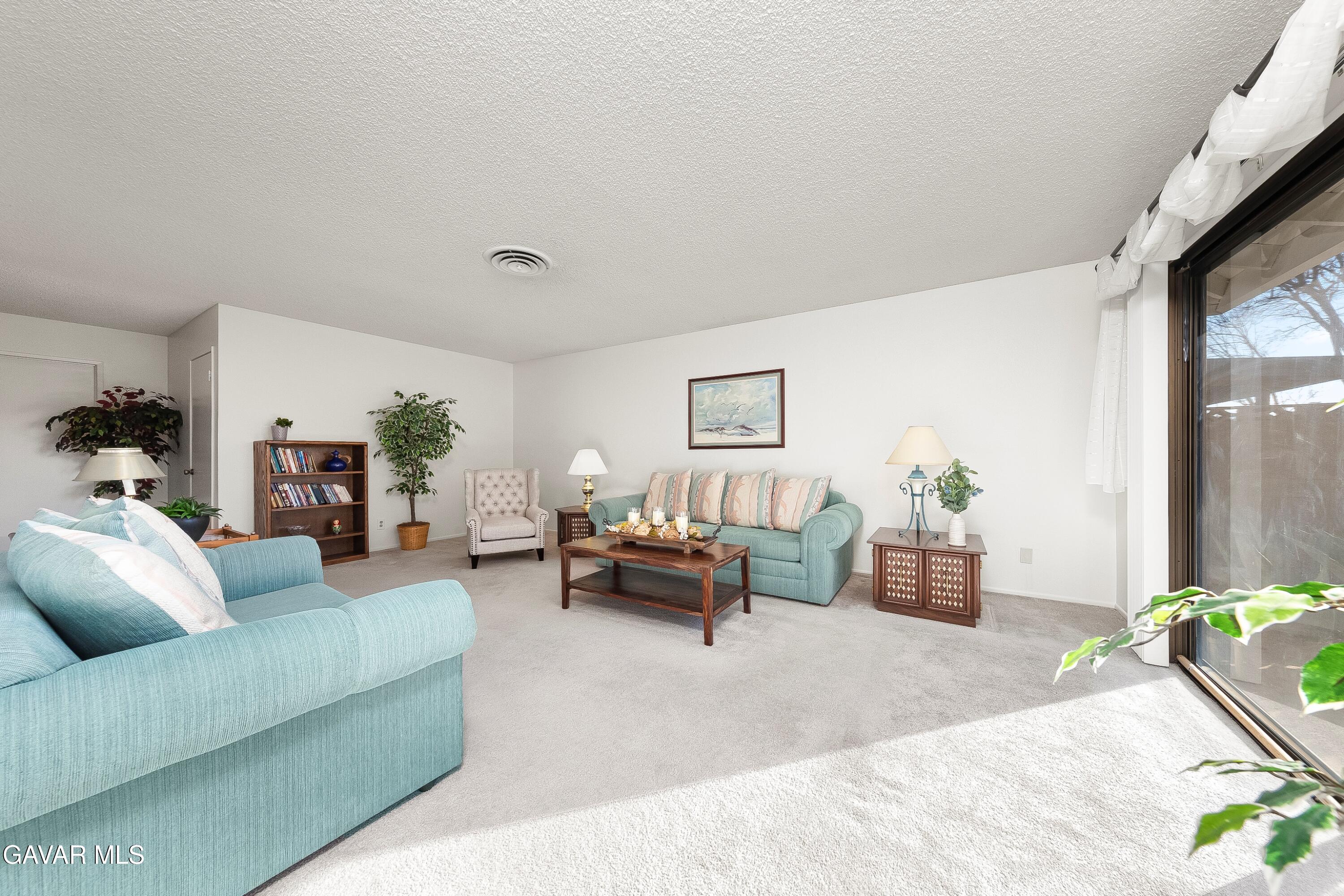 43755 Sentry Lane Lancaster, CA 93536 - Photo 5 of 36 a living room with furniture and a window